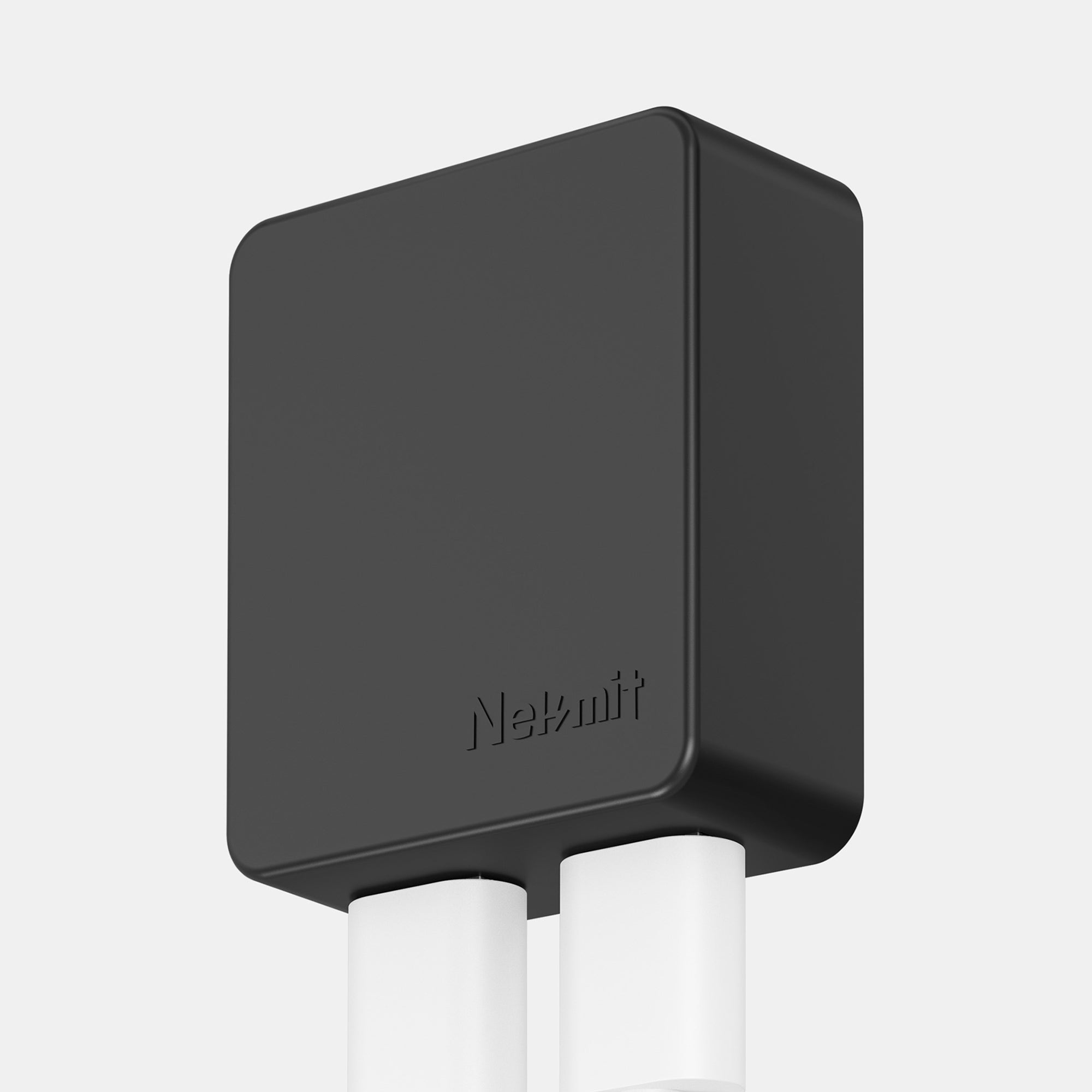 Black electronic device with 'Nekmit' branding on a light gray background