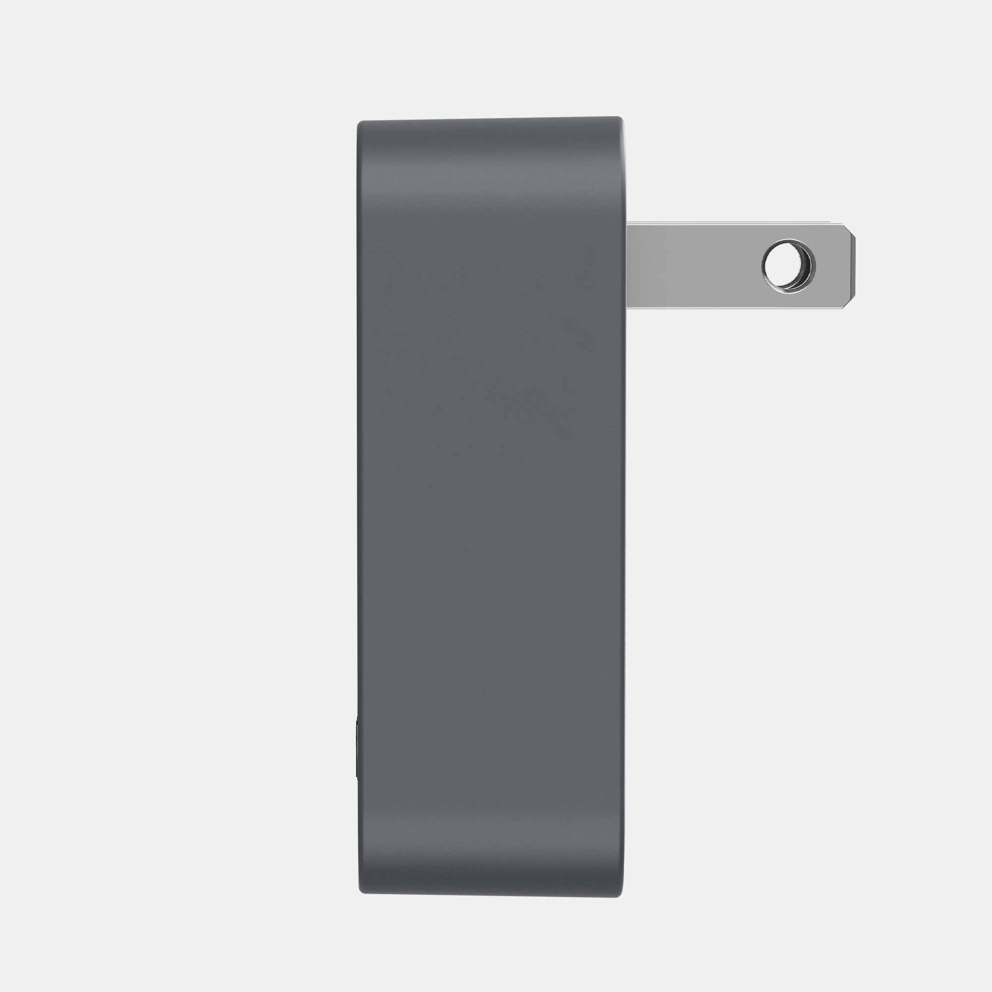 Gray wall adapter on a light gray background