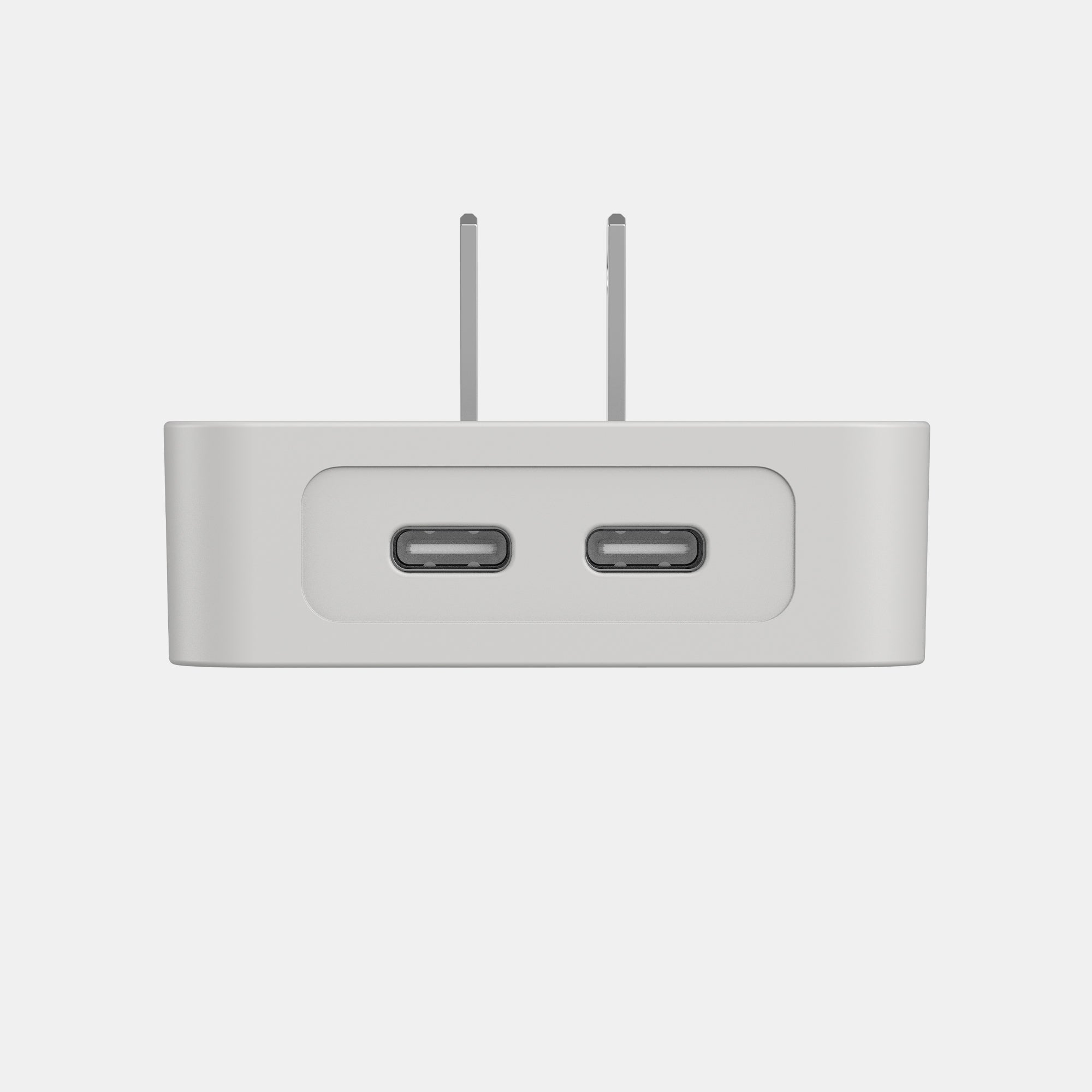 White electronic device with two USB ports on a light gray background