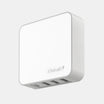 White USB hub with multiple ports on a light gray background