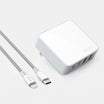White power adapter with multiple ports and a USB-C cable on a light gray background