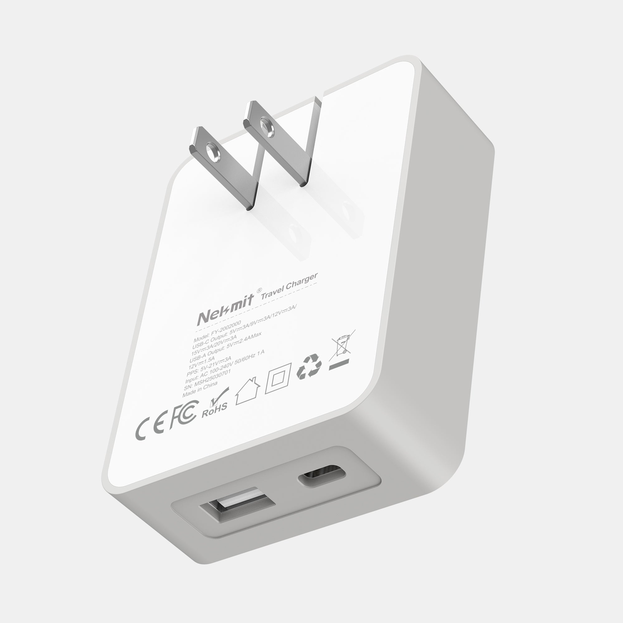White travel charger with USB ports on a light gray background