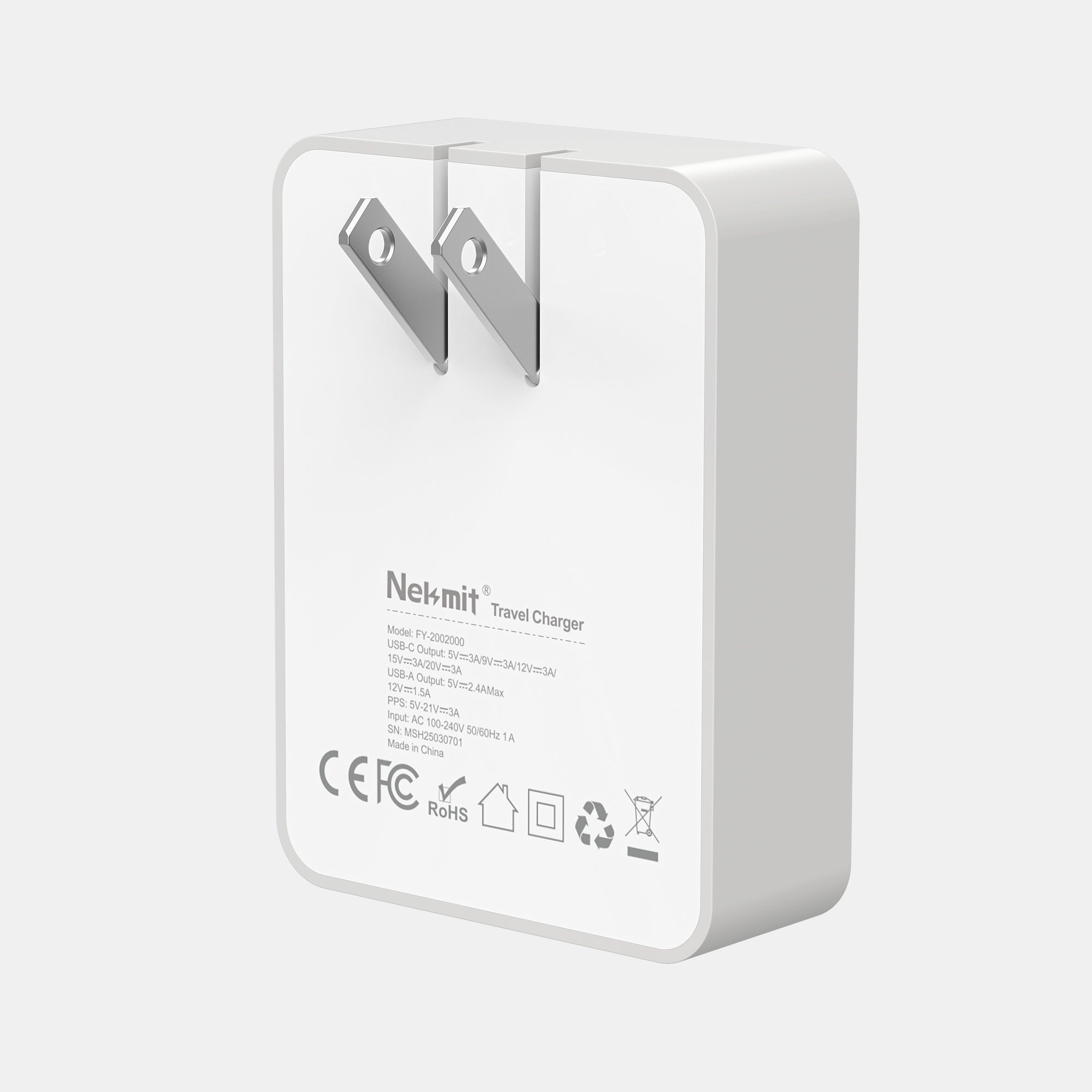 White travel charger with 'Nekmit' branding on a light gray background