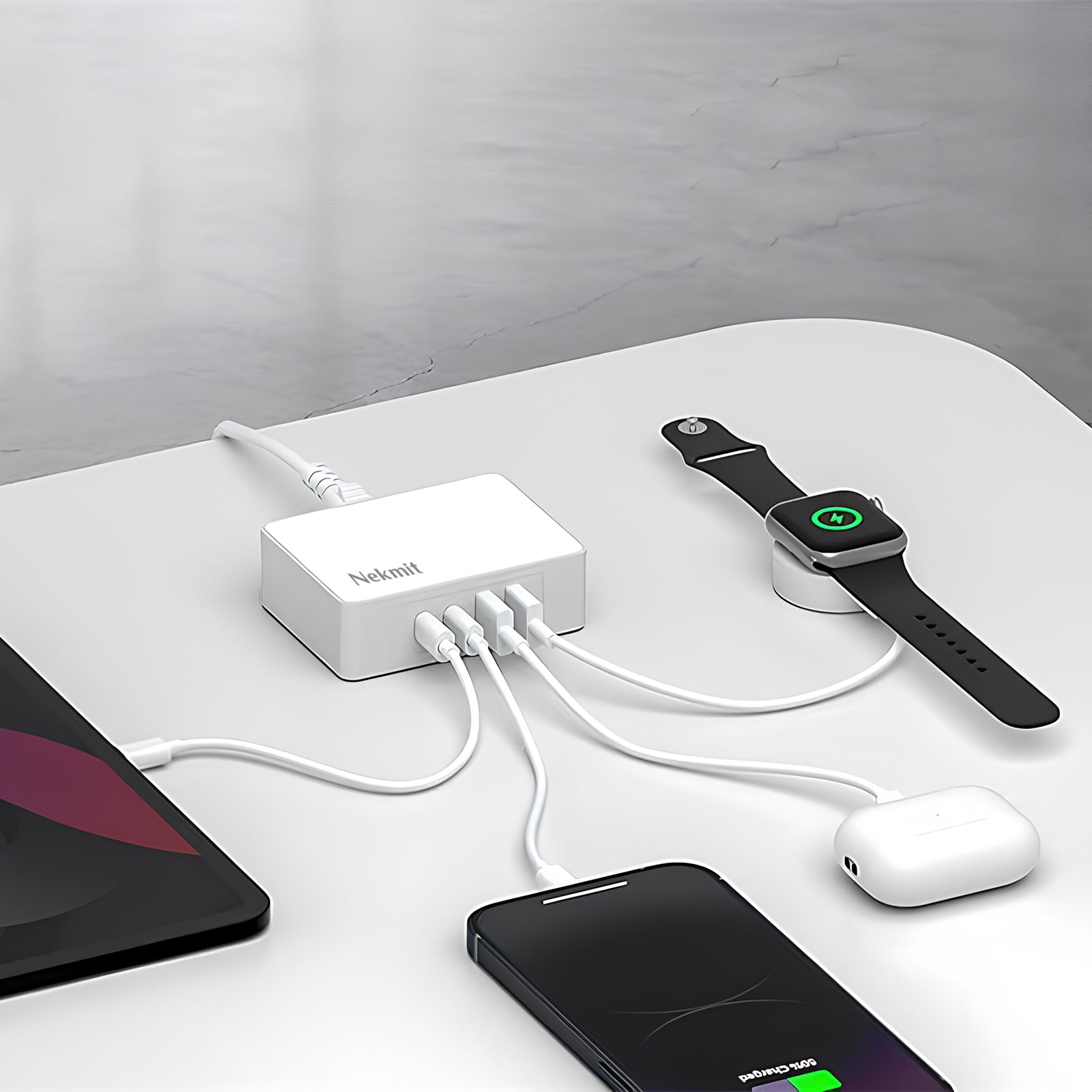 NedRo charging station with multiple devices on a white surface