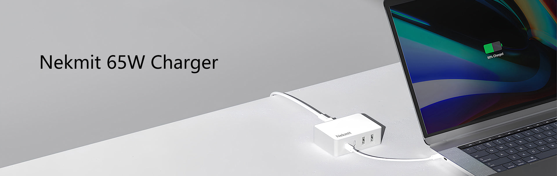 Nekmit 65W charger with a laptop on a light gray background