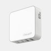 White power adapter with multiple ports on a light gray background