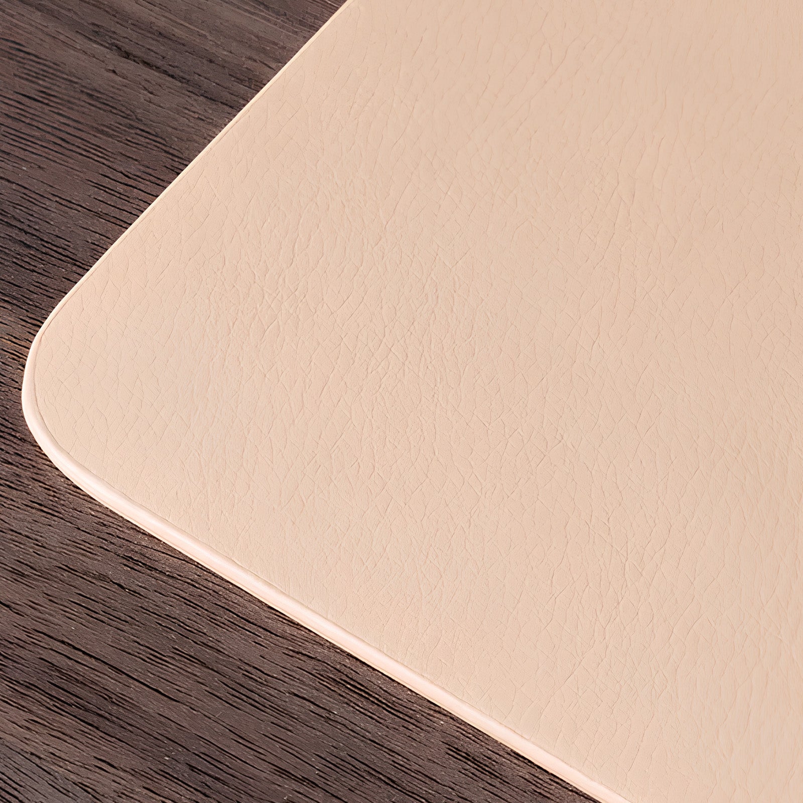 Beige mat on a wooden surface