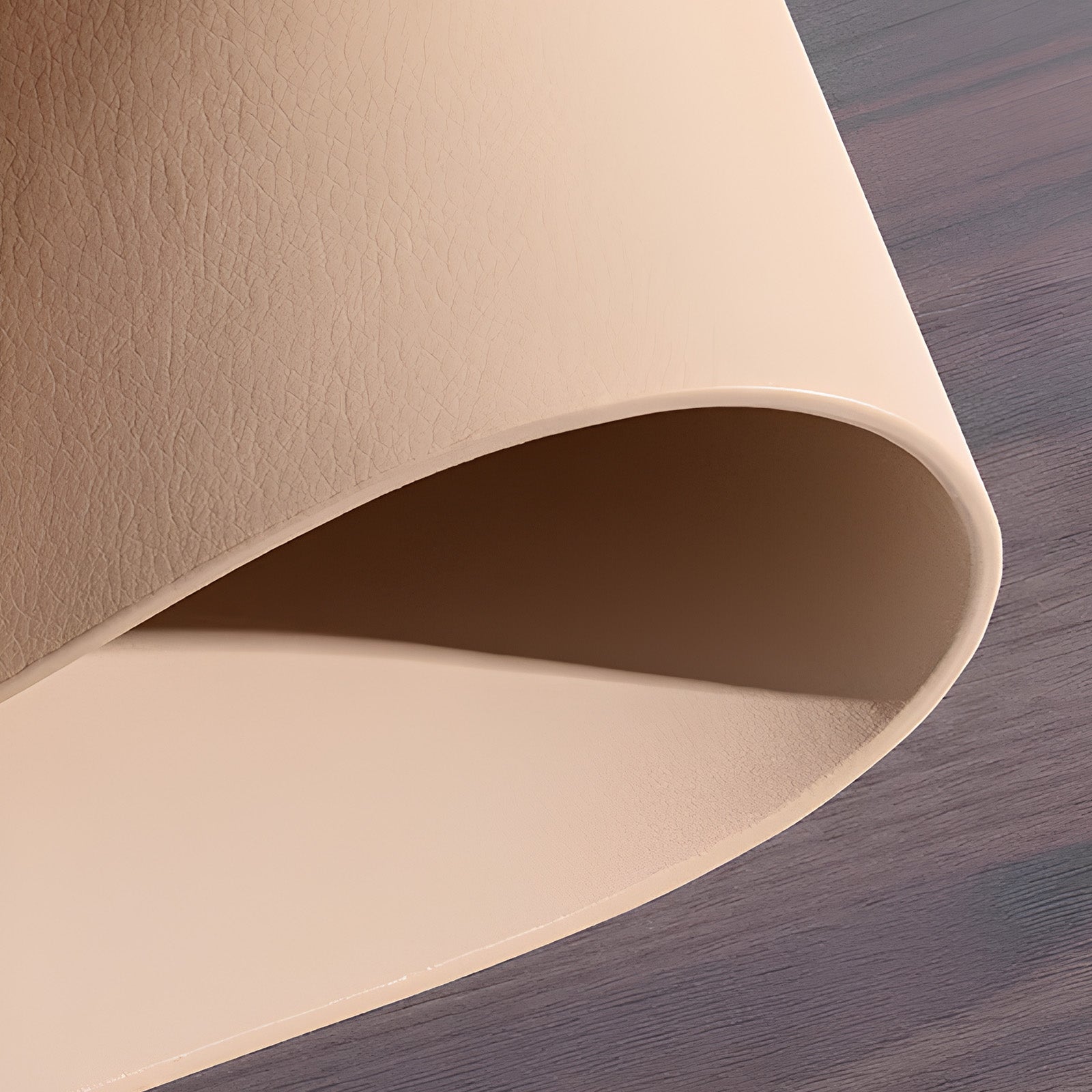 Close-up of beige leather on a wooden surface