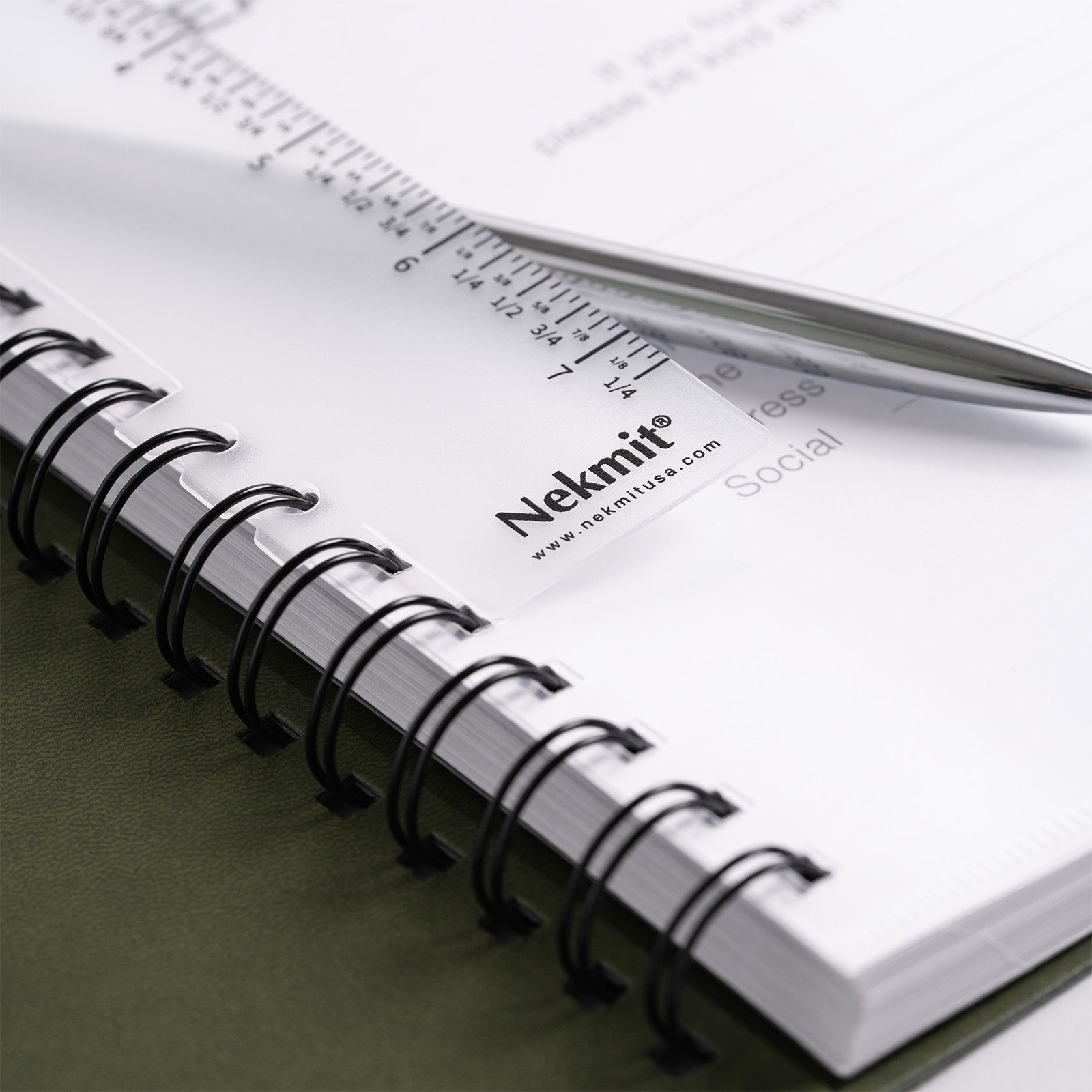 Open notebook with ruler and visible Nekmit branding