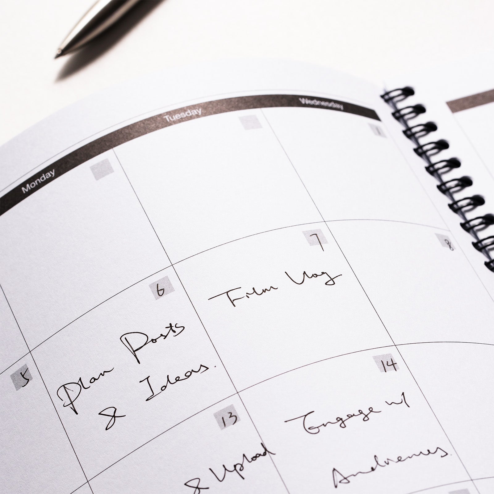 Calendar with handwritten notes on a white surface