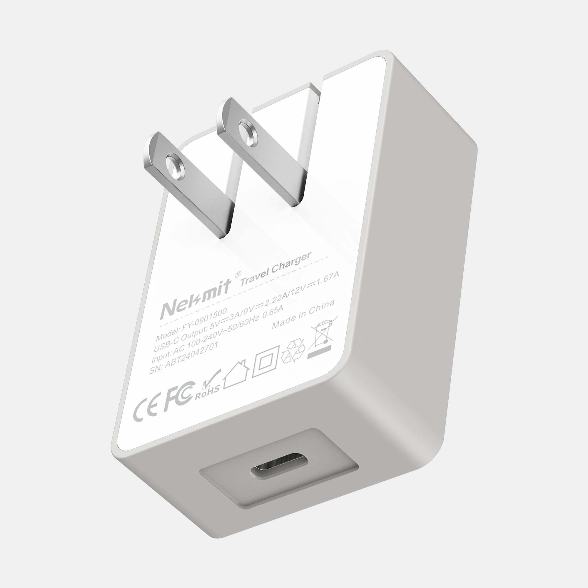 White travel charger with USB port on a light gray background