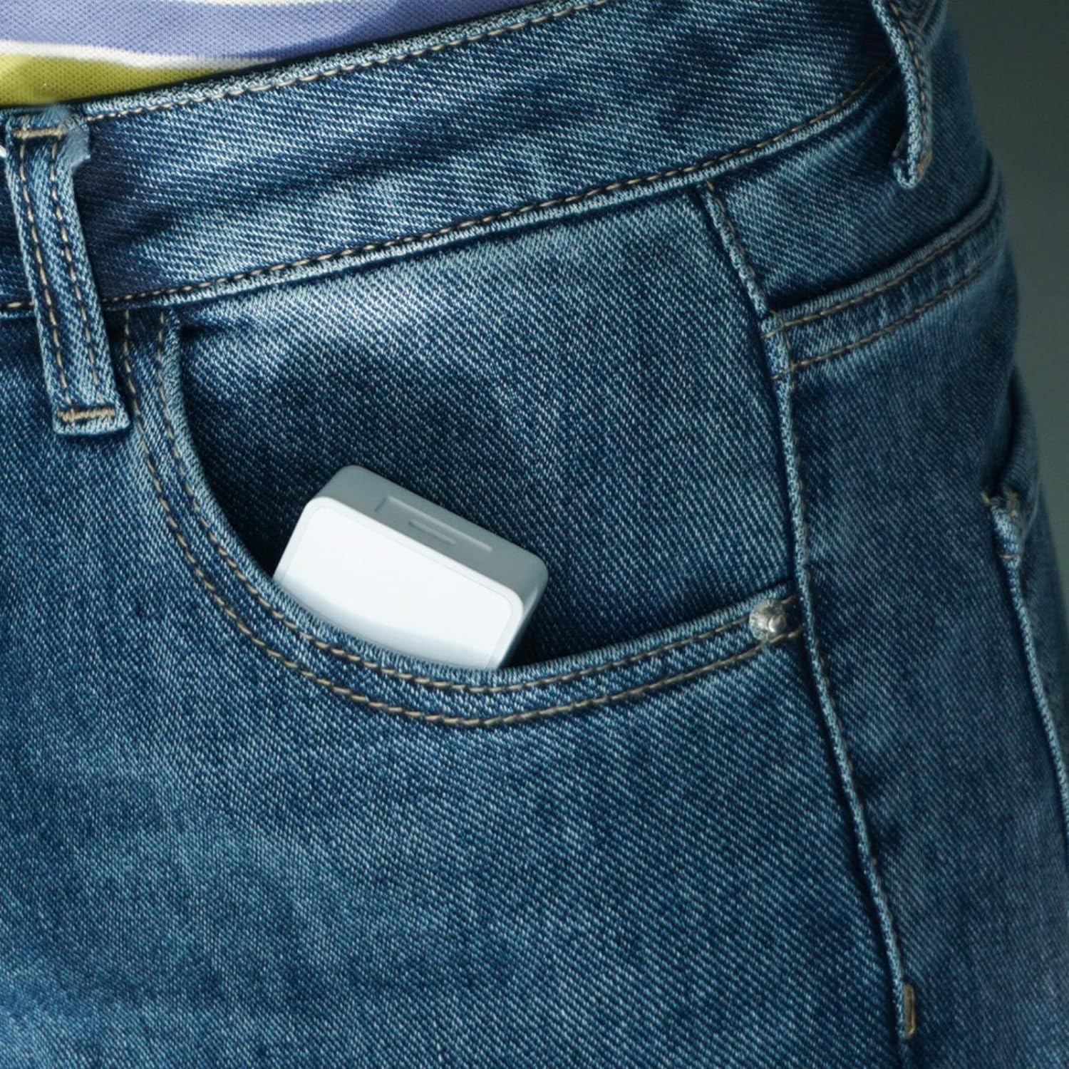 Small device in a pocket of blue jeans