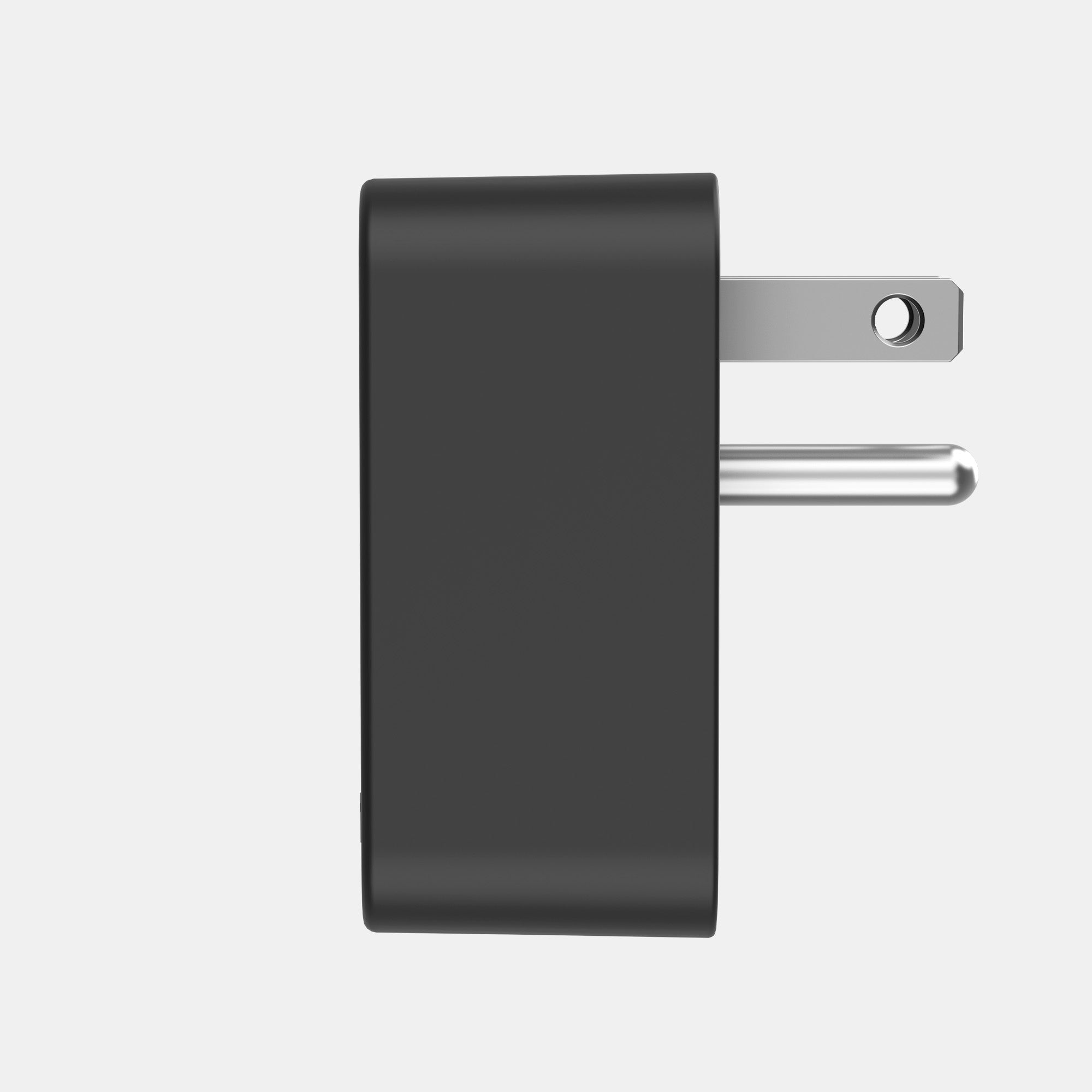 Black wall adapter on a light gray background