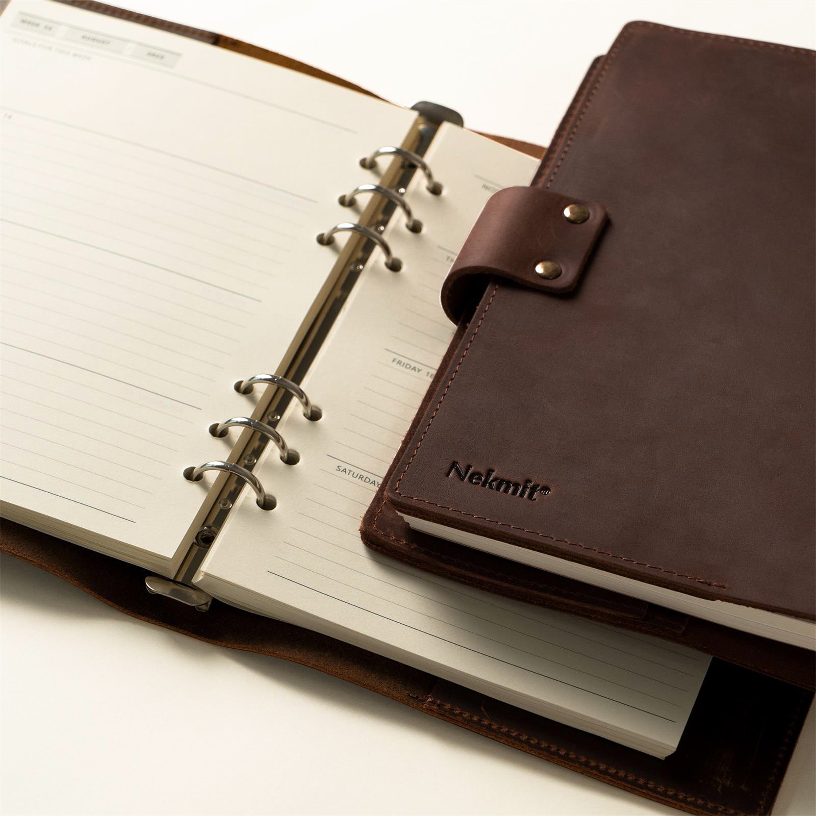 Brown planner with 'Nelmit' branding on a white background