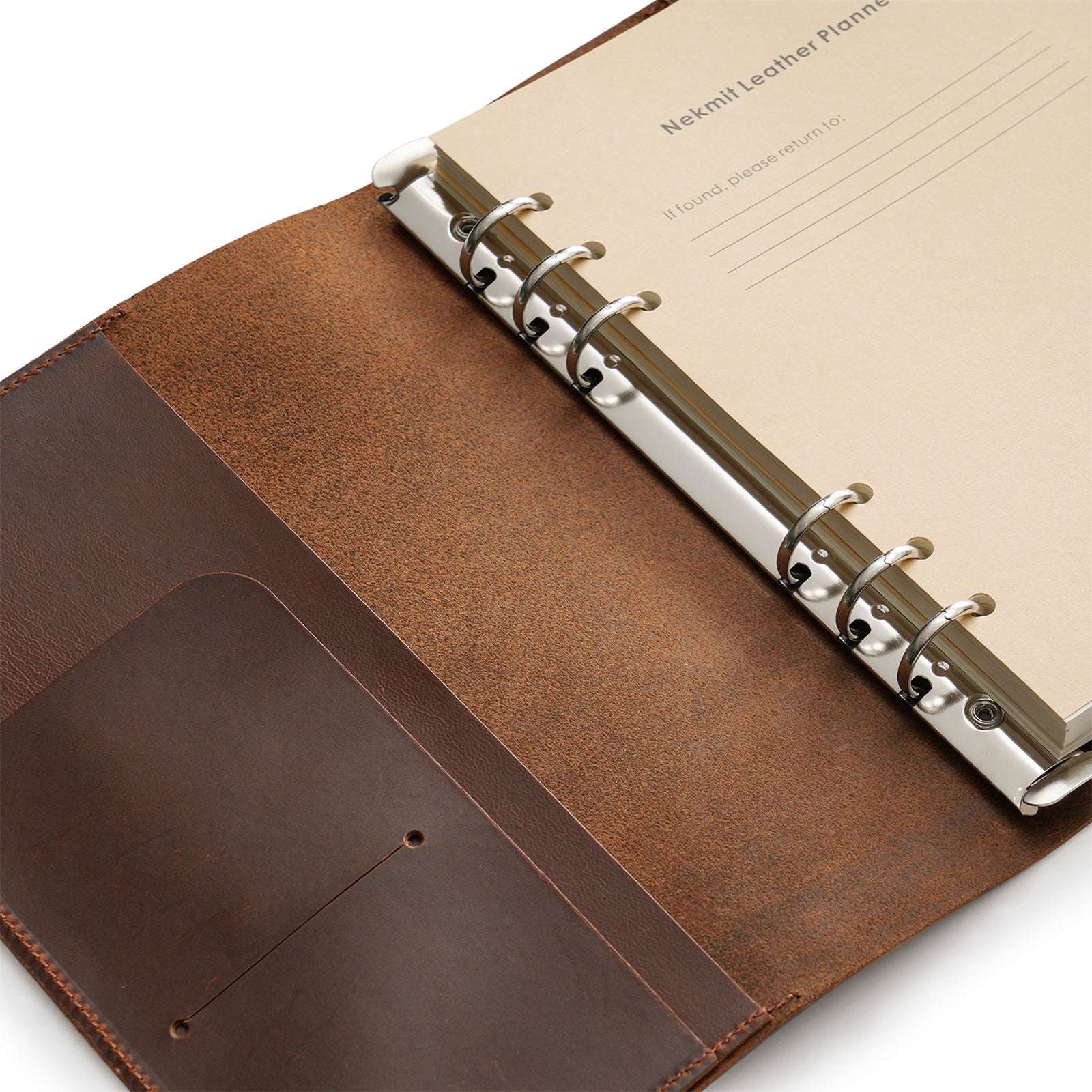 Brown leather planner with beige interior on a white background