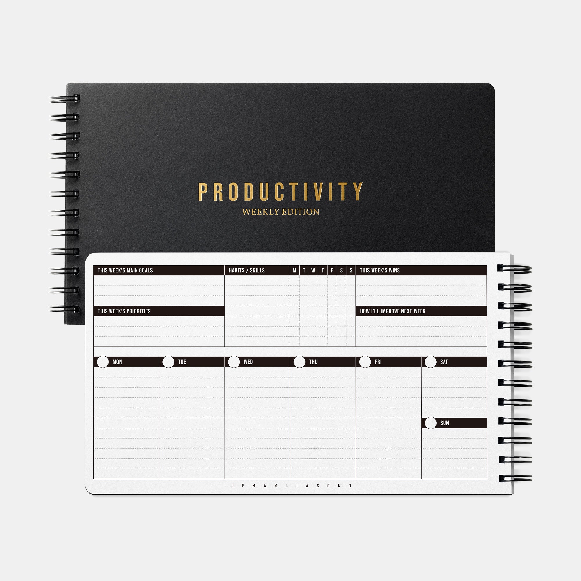 Black productivity planner with gold text on a white background